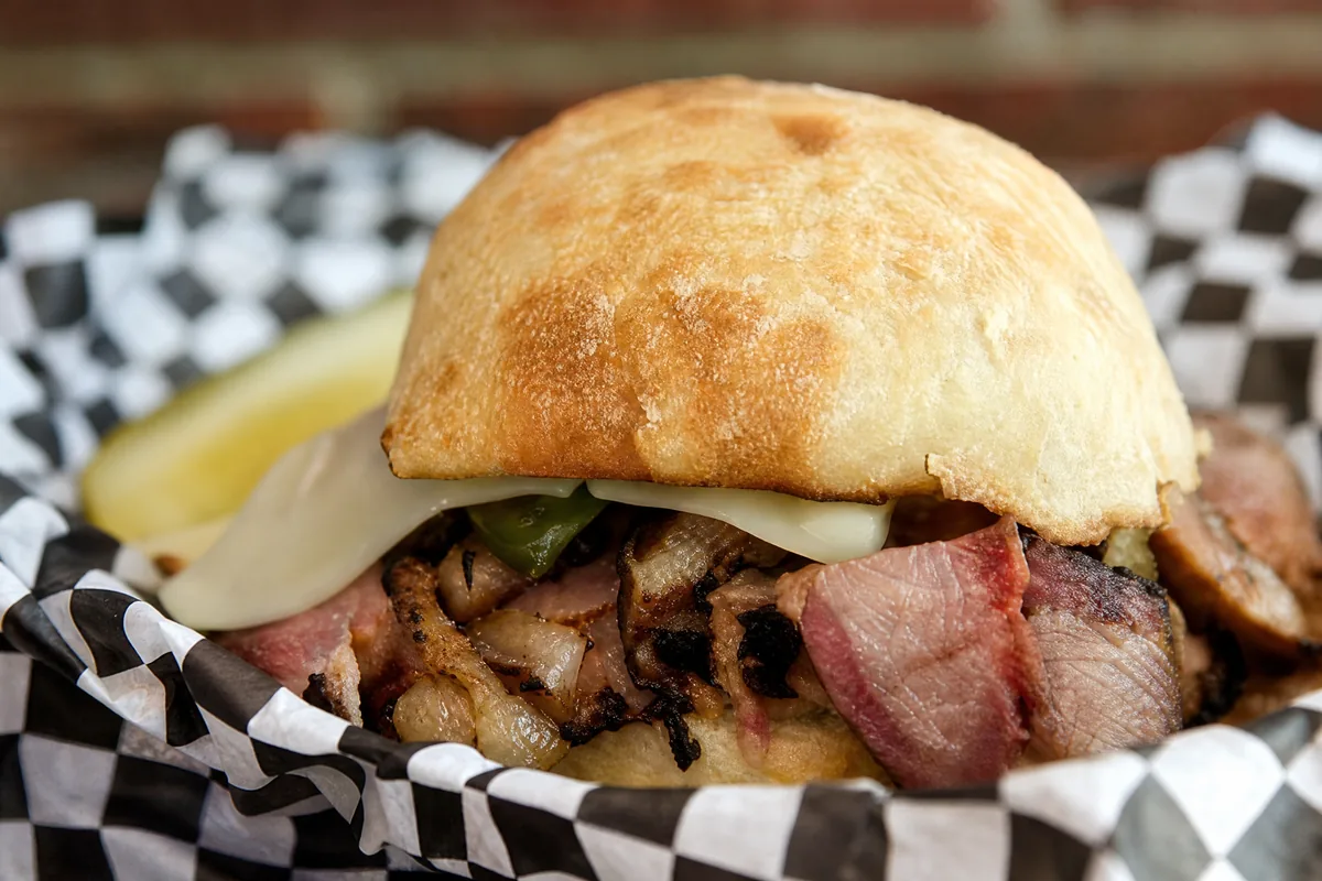 Music City Brisket sandwich with brisket, cheese, peppers, and onions